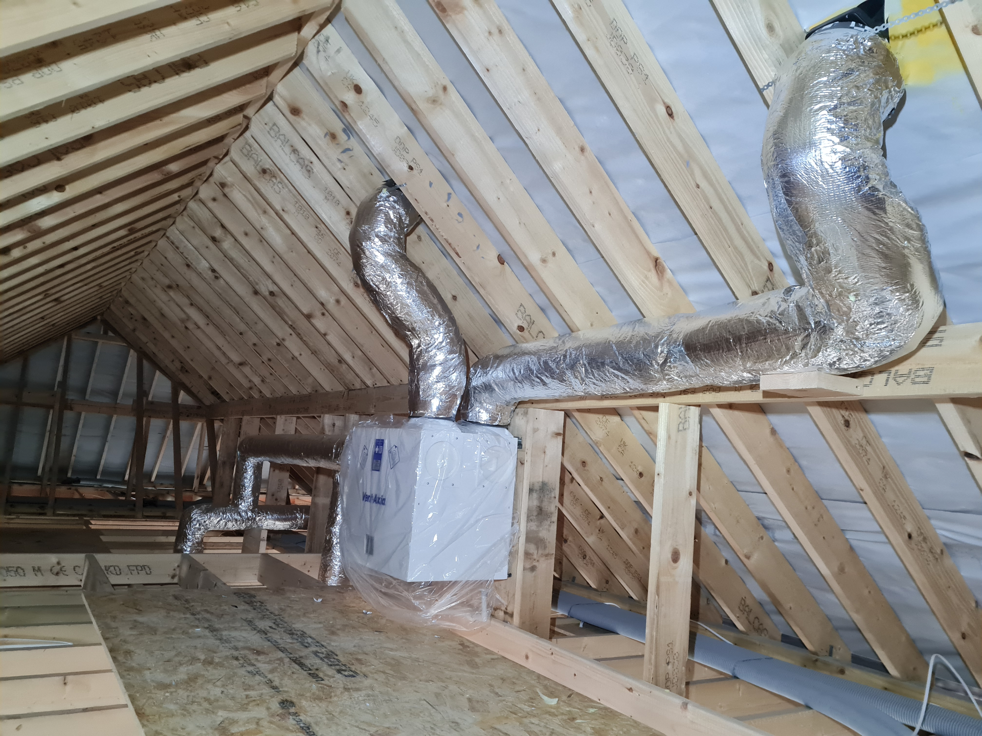 Insulated rigid ductwork feeding upstairs rooms